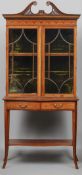 An Edwardian inlaid glazed cabinet on stand
215 cm high.