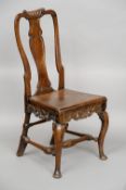 An early Georgian walnut side chair
With vase shaped splat back above the solid elm seat over a