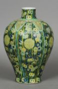 A Chinese porcelain baluster vase Overall decorated with rosettes and precious objects on a bamboo