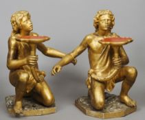 A pair of giltwood figural stands
Each modelled in crouching position.  Each 73 cms high.  (2)