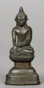 A small 19th century Sino-Tibetan bronze cast Buddha
Together with a small South East Asian bronze