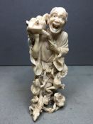 A 19th century Japanese carved ivory okimono
Of the Toad Immortal Gama Sennin, typically worked with