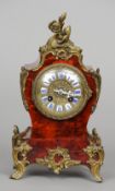 A 19th century French brass mounted red stained tortoiseshell  mantle clock
The stepped balloon