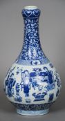 A Chinese blue and white porcelain bottle vase
Decorated with figures in traditional pursuits,