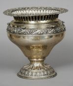 A Continental silver, possibly Italian, jardiniere
The shell cast rim above the main bulbous body