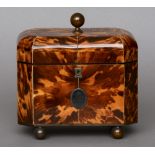 A 19th century ivory strung tortoiseshell tea caddy
Of domed canted rectangular form, the panelled