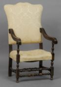 An 18th century style upholstered open armchair
The shaped padded back above acanthus carved