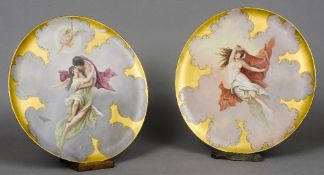 A pair of large 19th century Vienna painted porcelain wall plates One decorated with a loving couple