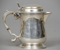 A George II silver lidded jug, probably hallmarked London 1748, maker's mark possibly BE
11.5 cm