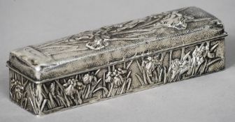 A small late 19th/early 20th century Japanese silver box The sides and the hinged lid decorated with