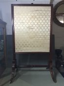 An early Victorian fire screen
56 cm wide x 101 cm high. CONDITION REPORTS: Generally in good