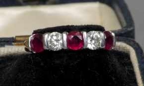 An 18 ct gold, diamond and ruby five-stone ring
Set with two diamonds and three rubies.  CONDITION