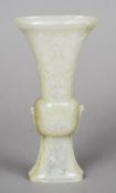 An 18th /19th century Chinese delicately carved pale celadon jade Gu vase,