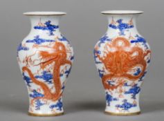 A pair of small Chinese vases
Each decorated with five clawed dragon chasing a flaming pearl, the