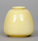 A Ruskin pottery beehive vase
With lemon lustre glaze, impressed mark Ruskin, England and dated