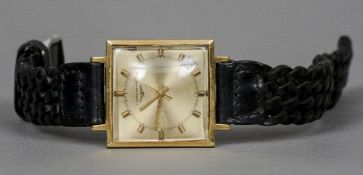 An 18 ct gold cased Longines gentleman's wristwatch
Of square section form.  3 cm wide. CONDITION