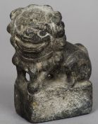A Chinese carved stone Buddhistic lion, possibly Ming Dynasty or earlier 
Typically worked.  14.5 cm