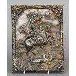 A white metal clad painted icon representing St. George killing the dragon
17 x 22 cm.
 CONDITION