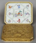 A 19th century Chinese cinnabar lacquer cased porcelain hors d'oeuvre set
Each piece painted with