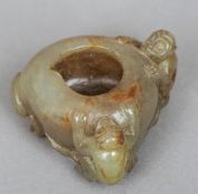 A Chinese carved russet jade brush washer
Modelled as a peach and two monkeys.  5.5 cm wide.