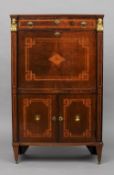 A 19th century Empire style mahogany secretaire abbatant 
With gilded mask headed columns flanking a