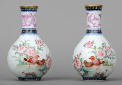 A pair of Chinese porcelain baluster vases
Each decorated with birds amongst floral sprays