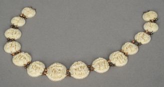 A late 19th century Canton carved ivory necklette
Formed from carved ivory roundels decorated with