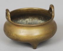 A Chinese bronze twin handled censor
Cast with six character Xuande mark.  14 cm wide. CONDITION