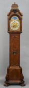 A 19th century Dutch burr walnut cased longcase clock
The domed fret carved top above the silvered