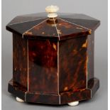 A 19th century ivory mounted tortoiseshell and mahogany tea caddy
Of octagonal form with flattened