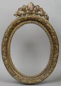 A carved giltwood frame
With blind cartouche cresting.  The aperture 40 x 51.5 cm. CONDITION