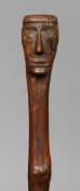 A 19th century carved wooden walking stick
The handle formed as a figural bust.  78.5 cm long.