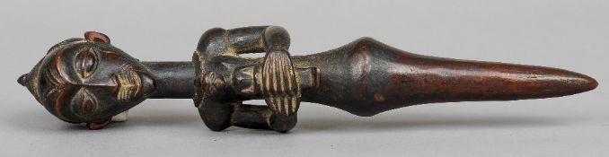 A carved African tribal figure, possibly a fertility figure, probably West African
Modelled as a