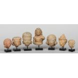 A collection of seven terracotta heads
Variously  modelled, all mounted.  The largest 13.5 cm high.