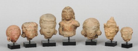 A collection of seven terracotta heads
Variously  modelled, all mounted.  The largest 13.5 cm high.