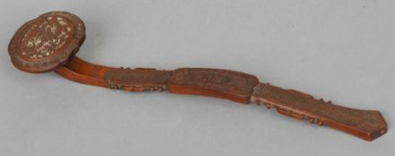 A late 19th/early 20th century Chinese carved wooden ruyi sceptre
Of typical form, the head carved