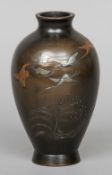 A Meiji period Japanese bronze vase
With mixed metal decoration, three character signature to base.