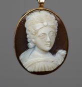 A 14 ct gold mounted hardstone cameo pendant
Formed as the bust of a classical maiden.  4.25 cm