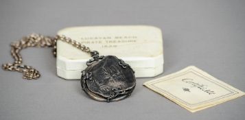 A silver mounted Spanish eight Reales (piece of eight) coin pendant, hallmarked London 1972, maker's