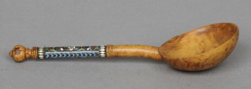 A Russian champleve enamel and karelian birch spoon
Of typical form.  19.5 cm long. CONDITION