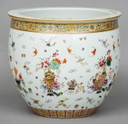 A Chinese porcelain jardiniere
Decorated with vases issuing flowers interspersed with precious