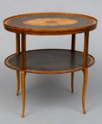 A 19th century inlaid satinwood oval centre table
The top with large central patera inlay, above