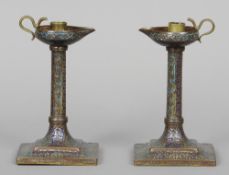 A pair of Indo-Persian enamel copper candlesticks
The drip trays formed as oil lamps.  20 cm high