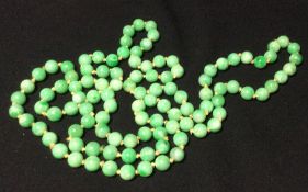 A string of 108 carved jade Buddhist prayer beads
122 cm long overall. CONDITION REPORTS: