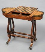 A 19th century brass inlaid rosewood games table, in the manner of Gillows
The brass galleried lobed