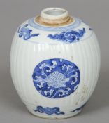 A Chinese porcelain blue and white jar (lacking cover)
The ribbed body decorated with lotus