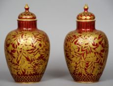 A pair of 19th century Royal Crown Derby porcelain urns and covers
Each decorated with gilt