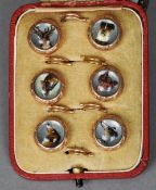 A cased set of Victorian unmarked yellow metal mounted Essex crystal studs
Each decorated with a