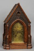 A 19th century oak cased architectural bracket clock
The silvered arched dial with Roman numerals