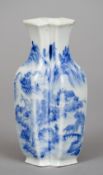 A Chinese porcelain double vase
Each of interlocking square section decorated with a continuous